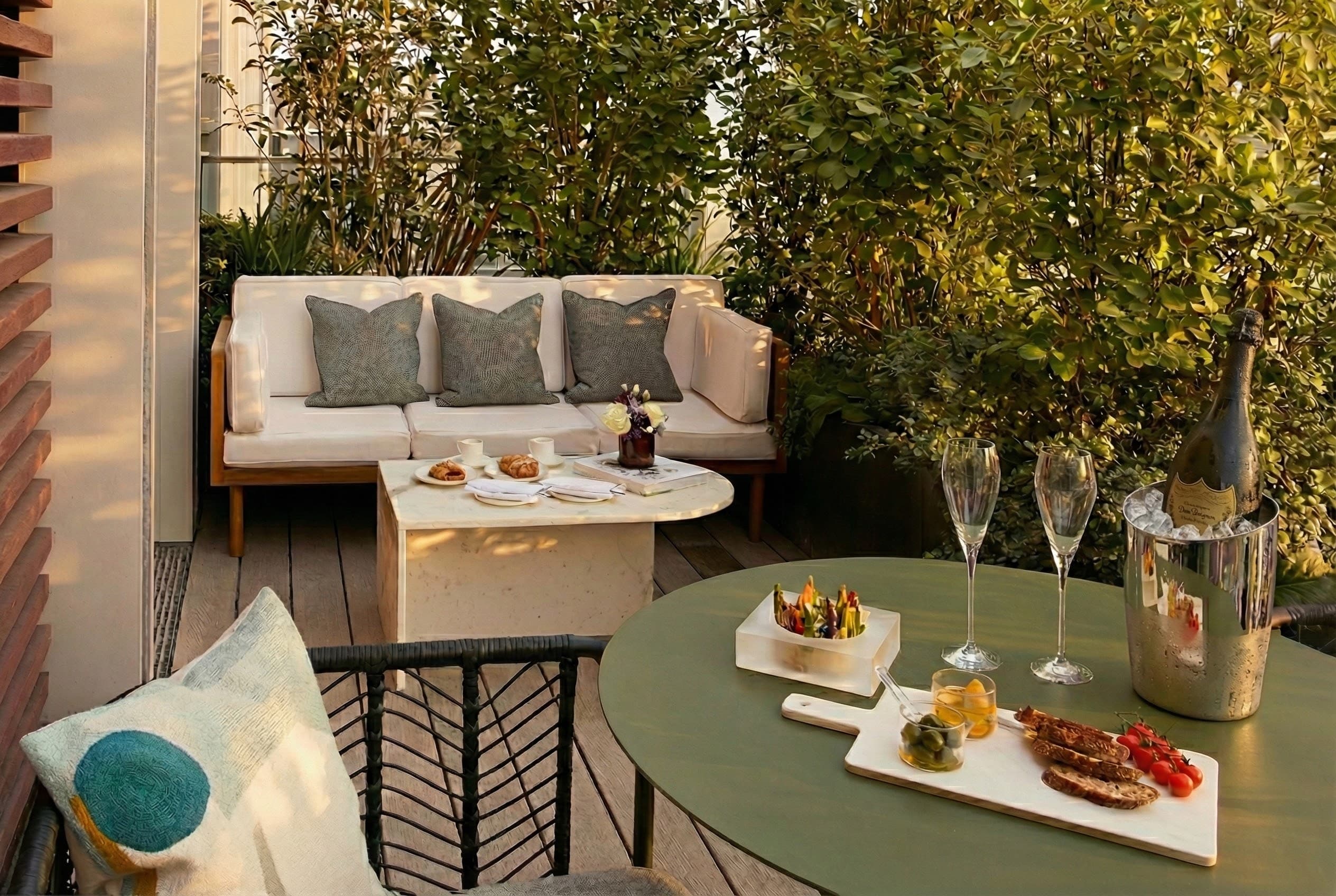 Private landscaped terrace with outdoor dining